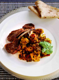 Spicy Braised Cauliflower with Lamb Cutlets and Herb Chutney